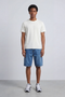 Front image of a model wearing Deep troy s/s tshirt in white, by brand Deep