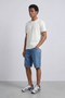 Front image of a model wearing the Deep troy s/s tshirt in white, by brand Deep