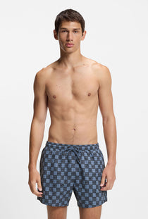 Front image of a model wearing the Hugo aaron swimshorts in navy, by brand Hugo