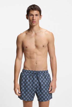 Front image of a model wearing the Hugo aaron swimshorts in navy, by brand Hugo