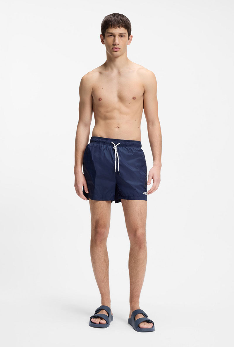 Front image of a model wearing Hugo evander sandal in navy, by brand Hugo