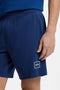 Front image of a model wearing the Laze shorts in blue, by brand Hugo