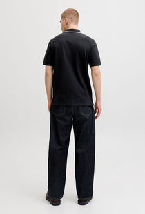 Back image of a model wearing the Blaze s/s polo in black, by brand Jack&jones