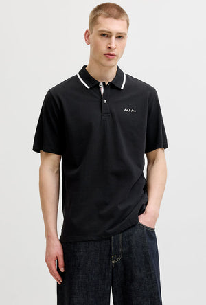 Front image of a model wearing the Blaze s/s polo in black, by brand Jack&jones