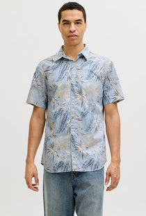 Front image of a model wearing the Honolulu aop ss shirt in blue, by brand Jack&jones