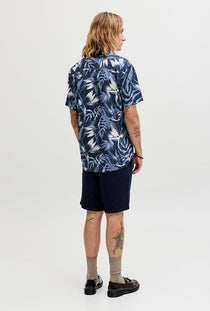 Back image of a model wearing the Honolulu aop ss shirt in navy, by brand Jack&jones
