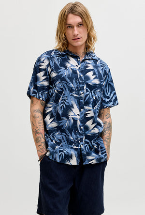 Front image of a model wearing the Honolulu aop ss shirt in navy, by brand Jack&jones