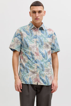 Front image of a model wearing the Honolulu aop ss shirt in off white, by brand Jack&jones