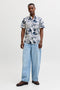 Front image of a model wearing the Honolulu aop ss shirt in white, by brand Jack&jones