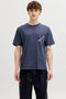 Front image of a model wearing Montauk aop pocket tee in navy, by brand Jack&jones