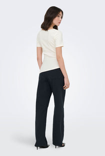 Back image of a model wearing the Catie s/s assymetric top in white, by brand Jacqueline de yong
