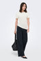 Front image of a model wearing the Catie s/s assymetric top in white, by brand Jacqueline de yong