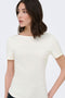 Front image of a model wearing the Catie s/s assymetric top in white, by brand Jacqueline de yong