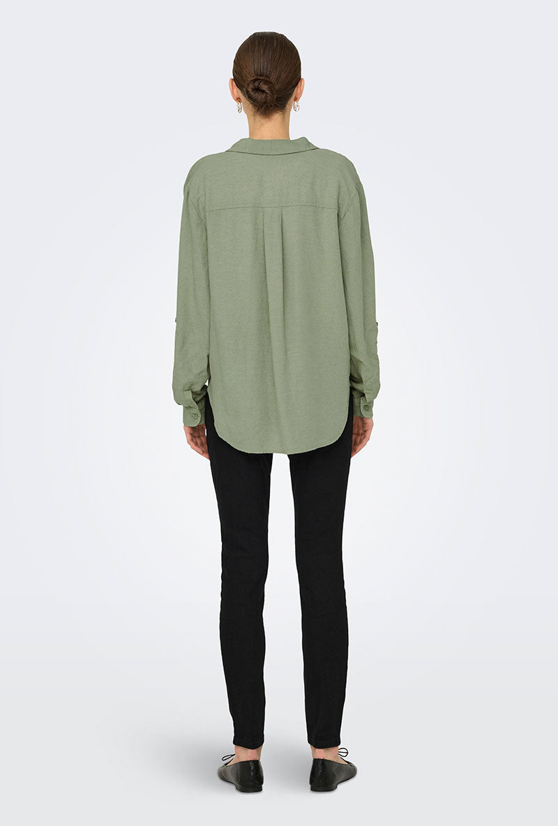 Back image of a model wearing Caya linen loose l/s shirt in sage, by brand Jacqueline de yong
