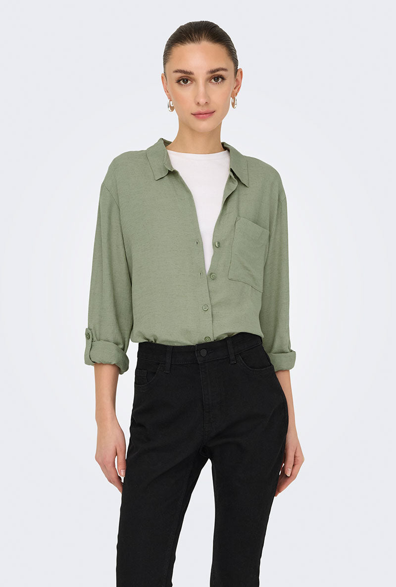 Front image of a model wearing Caya linen loose l/s shirt in sage, by brand Jacqueline de yong