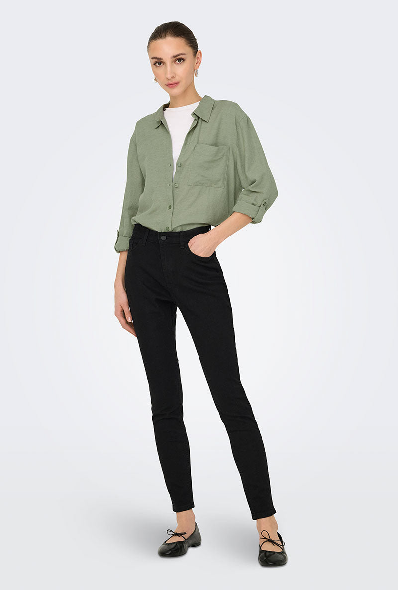Front image of a model wearing Caya linen loose l/s shirt in sage, by brand Jacqueline de yong