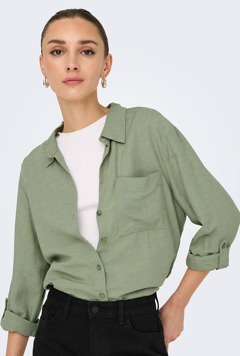 Front image of a model wearing Caya linen loose l/s shirt in sage, by brand Jacqueline de yong