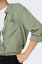 Detail image of a model wearing the Caya linen loose l/s shirt in sage, by brand Jacqueline de yong