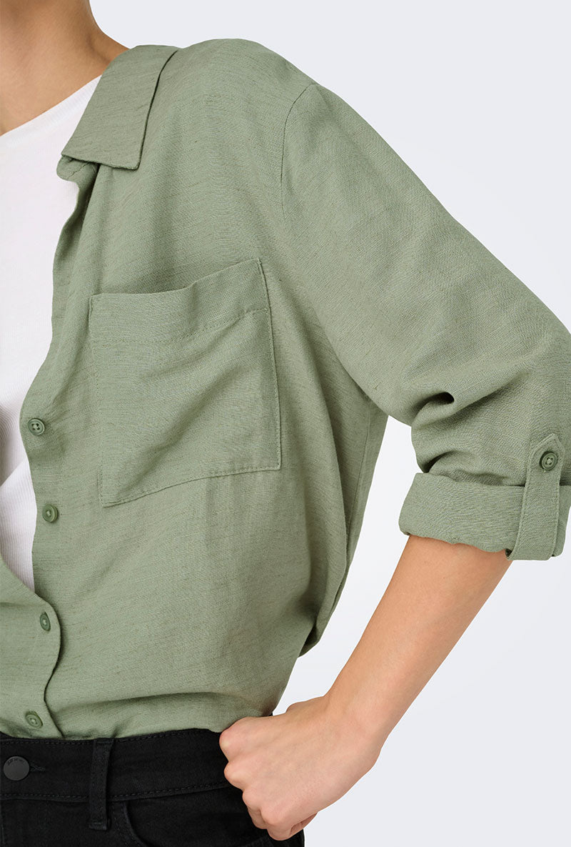 Detail image of a model wearing Caya linen loose l/s shirt in sage, by brand Jacqueline de yong
