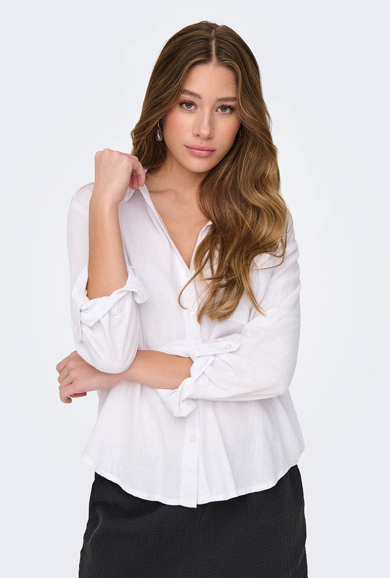 Front image of a model wearing Caya linen loose l/s shirt in white, by brand Jacqueline de yong