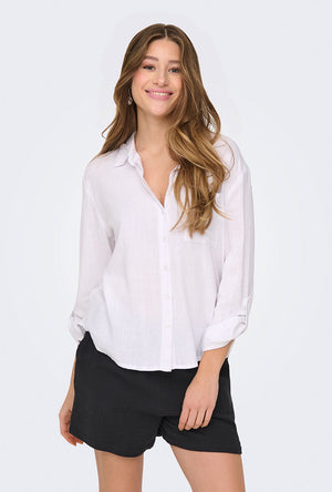 Front image of a model wearing the Caya linen loose l/s shirt in white, by brand Jacqueline de yong