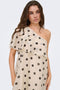 Front image of a model wearing the Fay life one shoulder drss in cream, by brand Jacqueline de yong