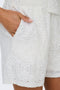 Front image of a model wearing the Nulle life shorts in off white, by brand Jacqueline de yong
