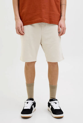 Front image of a model wearing Gordon bradley sweat shorts in stone, by brand Jack&jones