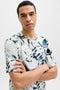 Front image of a model wearing the Honolulu aop ss tee in beige, by brand Jack&jones