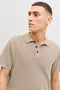 Front image of a model wearing the Jess knit polo in stone, by brand Jack&jones