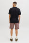 Back image of a model wearing the Jess knit polo in black, by brand Jack&jones