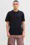 Front image of a model wearing Jess knit polo in black, by brand Jack&jones