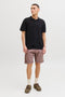 Front image of a model wearing the Jess knit polo in black, by brand Jack&jones