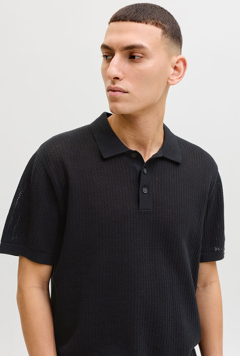 Front image of a model wearing Jess knit polo in black, by brand Jack&jones