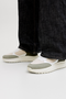 Front image of a model wearing Jack and jones aspire pu runner in white, by brand Jack&jones