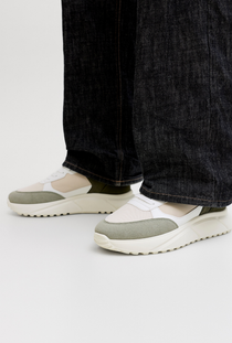 Front image of a model wearing the Jack and jones aspire pu runner in white, by brand Jack&jones
