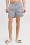 Front image of a model wearing Maui ocean seersucker swimshorts in navy, by brand Jack&jones