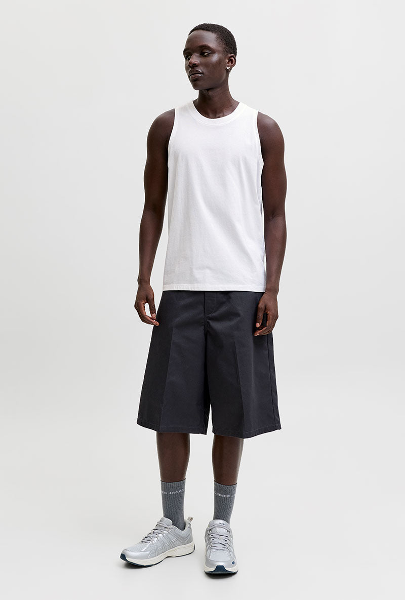 Front image of a model wearing Sunset back print sleeveless tshirt in white, by brand Jack&jones