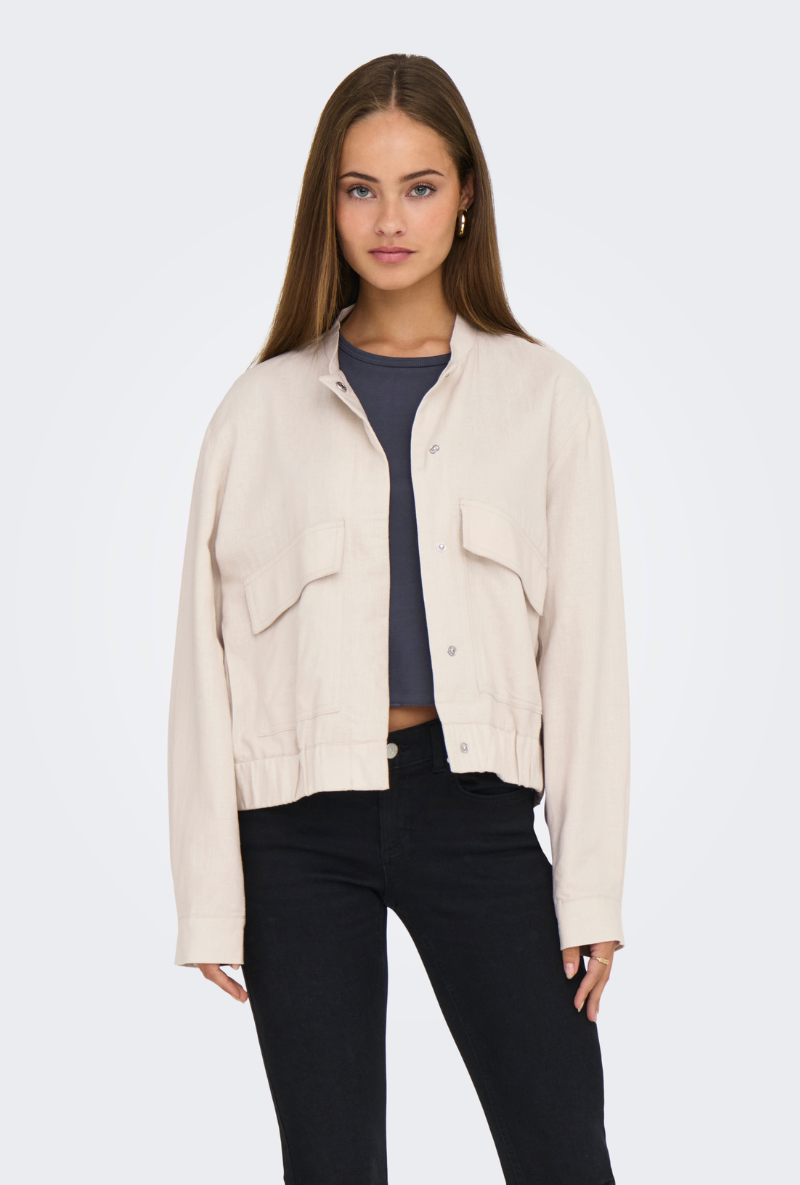 Front image of a model wearing Jdy karin linen mix short jacket in oat, by brand Jacqueline de yong