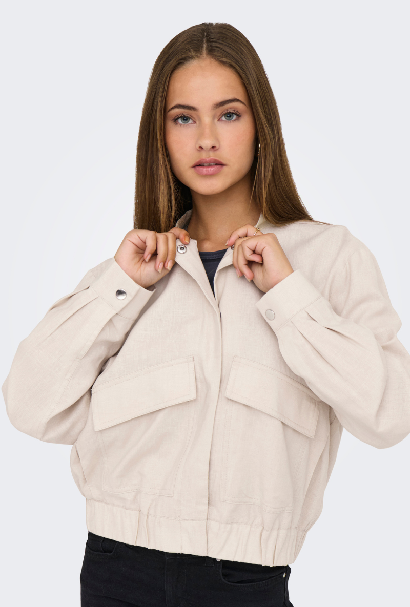 Front image of a model wearing Jdy karin linen mix short jacket in oat, by brand Jacqueline de yong