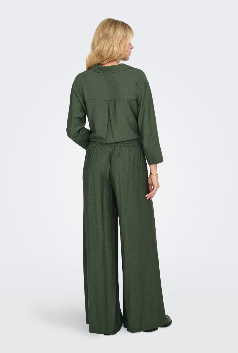Back image of a model wearing Jdy pepper palazzo pants in olive, by brand Jacqueline de yong