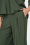 Detail image of a model wearing the Jdy pepper palazzo pants in olive, by brand Jacqueline de yong