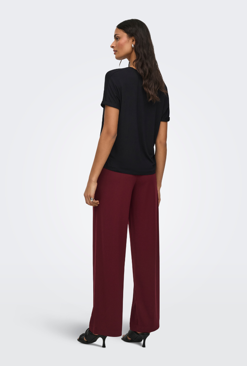 Back image of a model wearing Jdy sissy s/s vneck top in black, by brand Jacqueline de yong