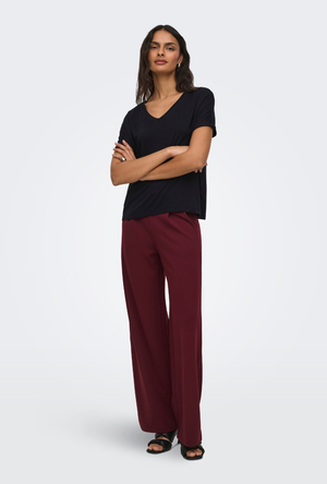 Front image of a model wearing the Jdy sissy s/s vneck top in black, by brand Jacqueline de yong