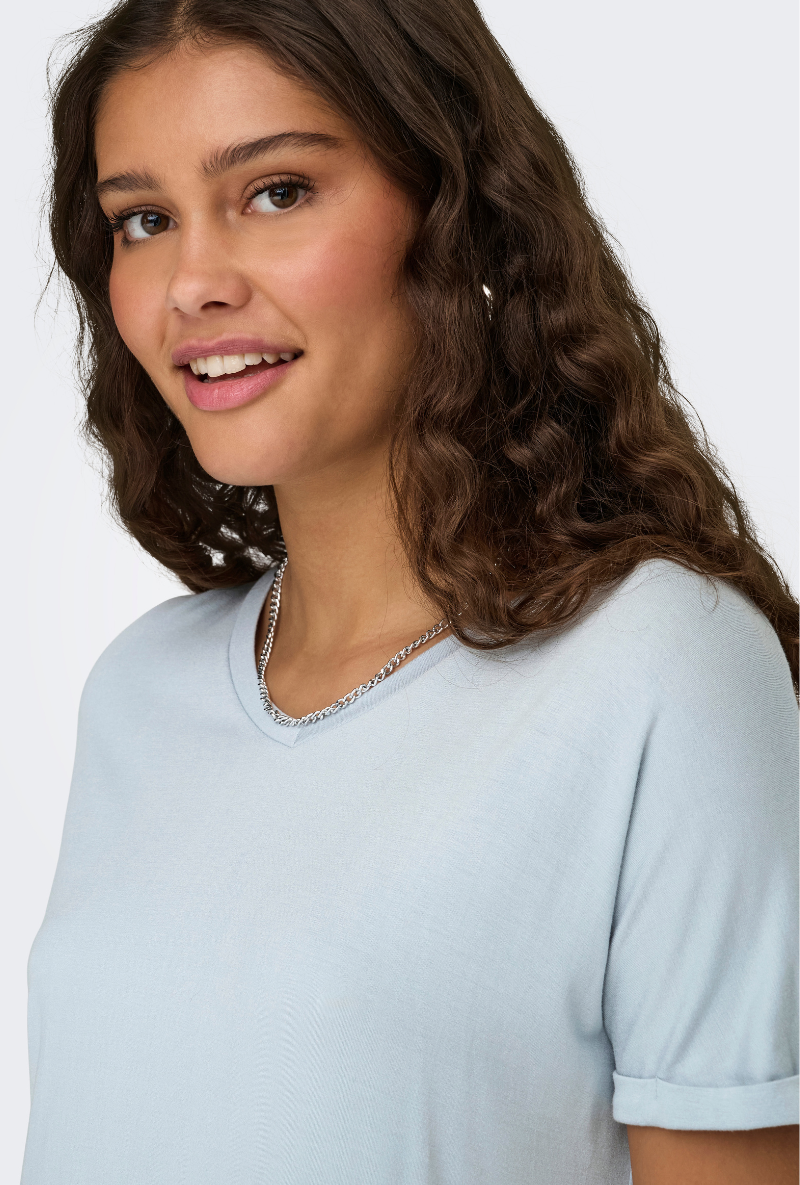 Detail image of a model wearing Jdy sissy s/s vneck top in light blue, by brand Jacqueline de yong