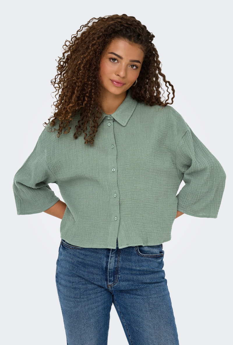 Front image of a model wearing Jdy theis life 3/4 crop shirt in sage, by brand Jacqueline de yong