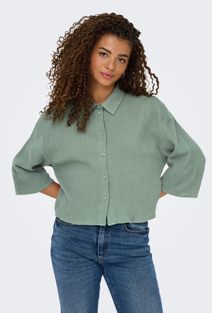 Front image of a model wearing the Jdy theis life 3/4 crop shirt in sage, by brand Jacqueline de yong