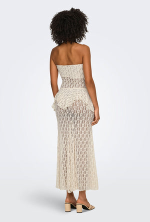 Back image of a model wearing the Laya lace long skirt in cream, by brand Only