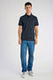 Front image of a model wearing the Needle drop s/s polo in navy, by brand Lindbergh