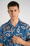 Front image of a model wearing the Aop lyocell s/s shirt in blue, by brand Lindbergh